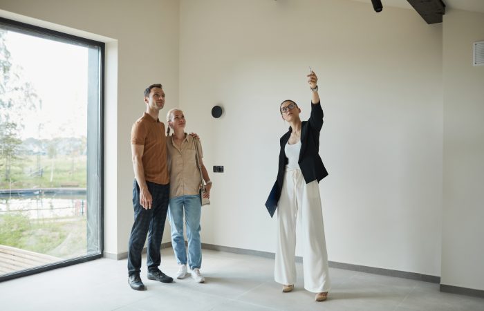 Real Estate Agent presenting House Real Estate Agent presenting House